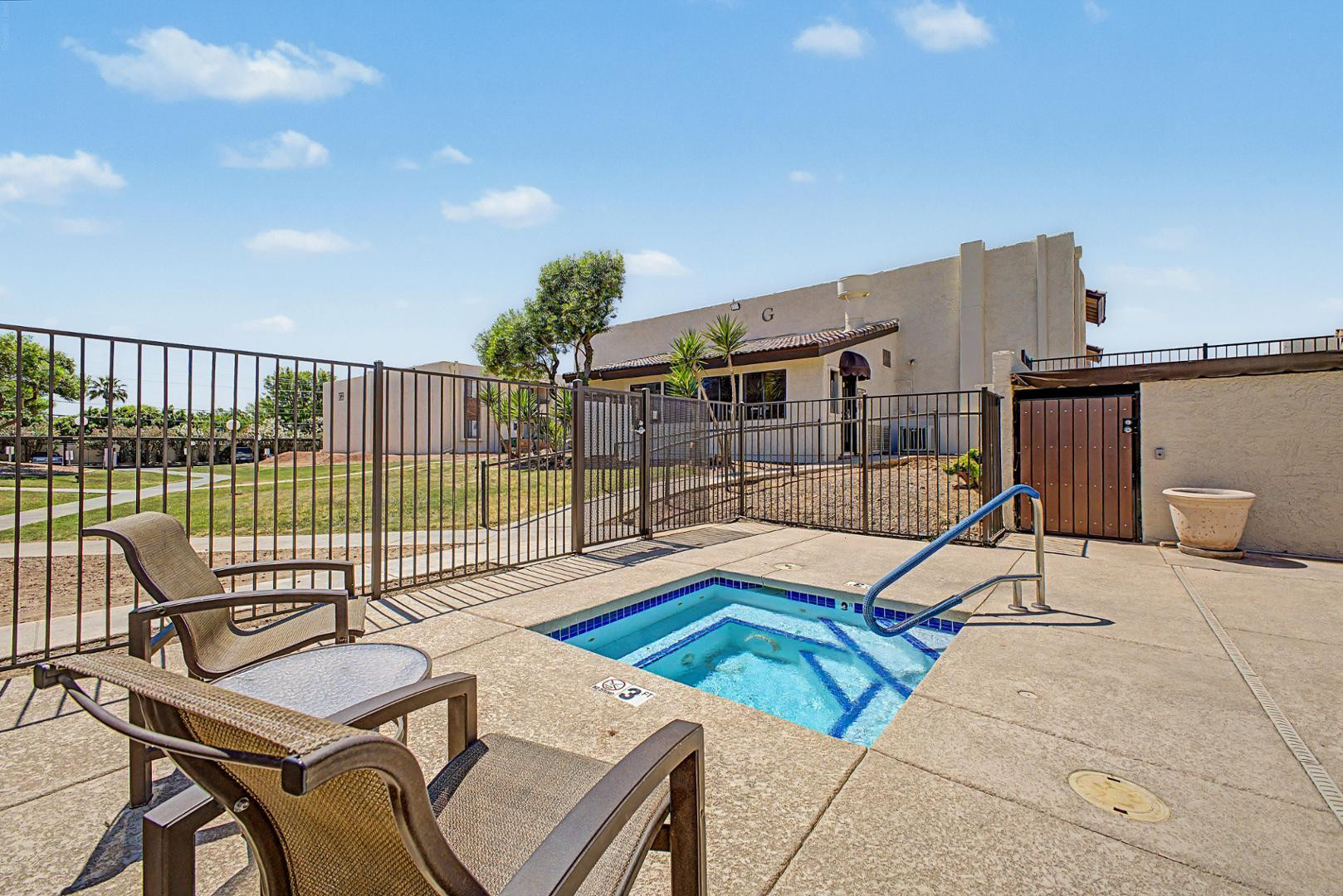 3825 East Camelback Road, Unit 144 Phoenix, AZ 85018 - Photo 25 of 35 a view of a chairs and table on the terrace