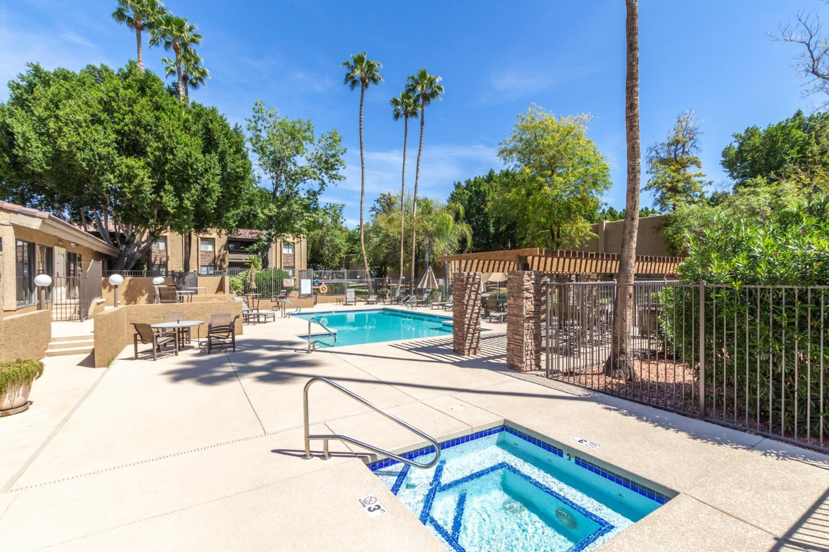 3825 East Camelback Road, Unit 144 Phoenix, AZ 85018 - Photo 35 of 35 a view of a swimming pool with a patio