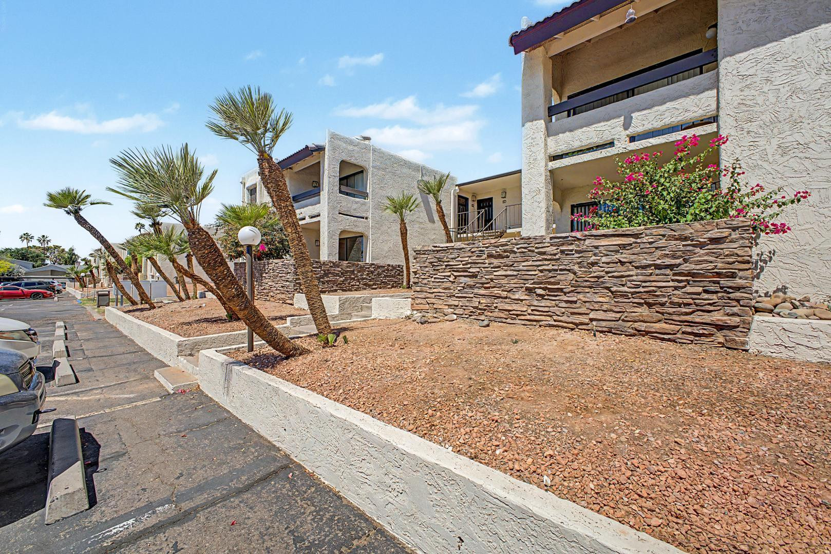 3825 East Camelback Road, Unit 144 Phoenix, AZ 85018 - Photo 4 of 35 a view of a house with a yard