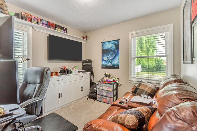 65 West 700 North Bountiful, UT 84010 - Photo 21 of 29 Light-filled room featuring neutral wall tones and a window with horizontal blinds