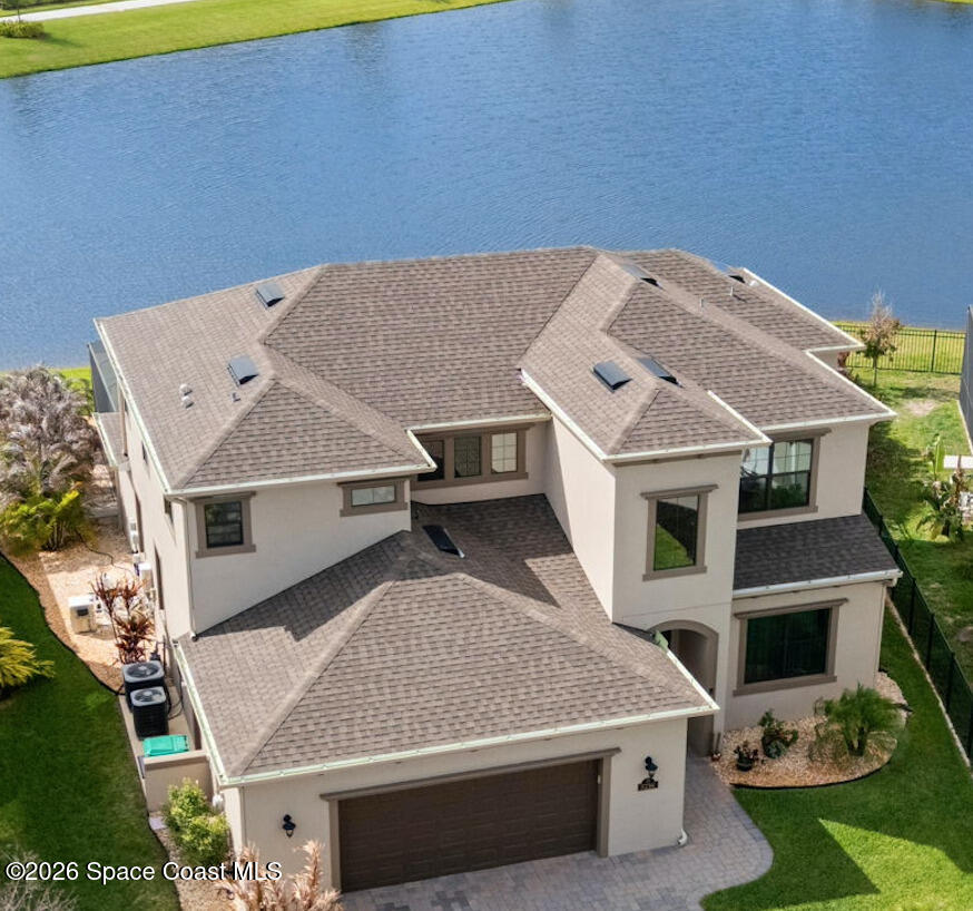 3236 Becorden Way Melbourne, FL 32940 - Photo 1 of 40 an aerial view of a house with a yard