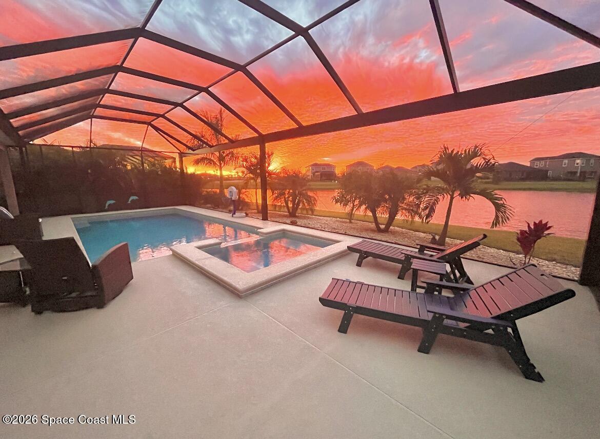 3236 Becorden Way Melbourne, FL 32940 - Photo 2 of 40 a sitting area with view of lake