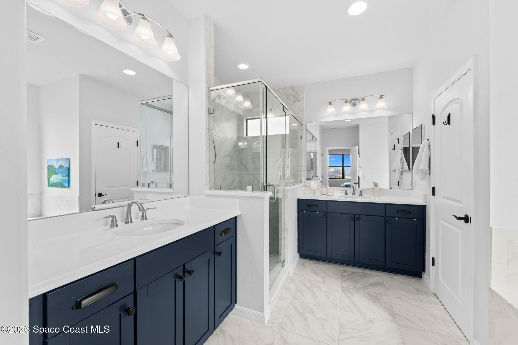 3236 Becorden Way Melbourne, FL 32940 - Photo 21 of 40 a bathroom with a double vanity sink mirror and double