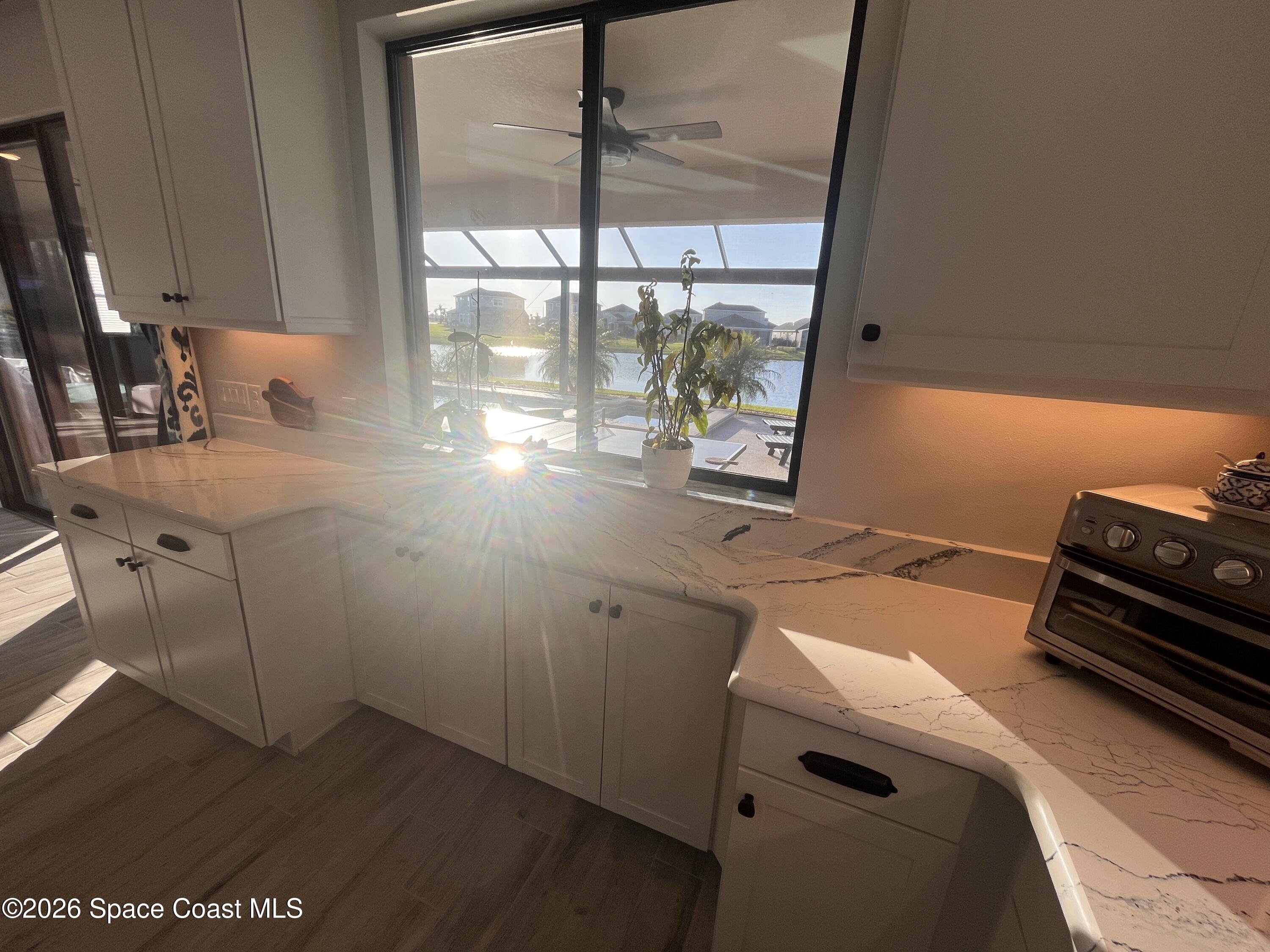3236 Becorden Way Melbourne, FL 32940 - Photo 23 of 40 a room with storage and utility