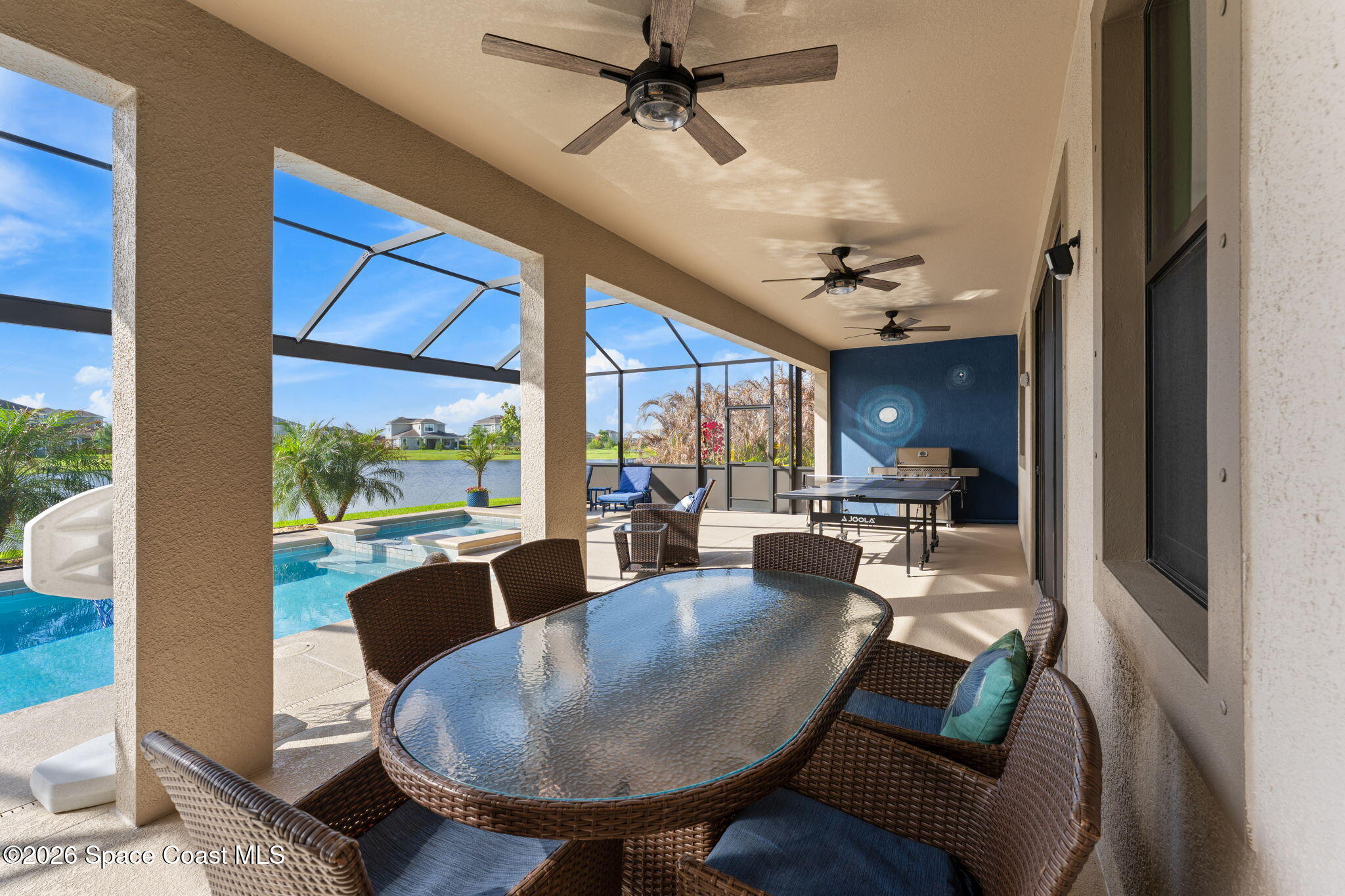3236 Becorden Way Melbourne, FL 32940 - Photo 30 of 40 a dining room with furniture a rug and a large window