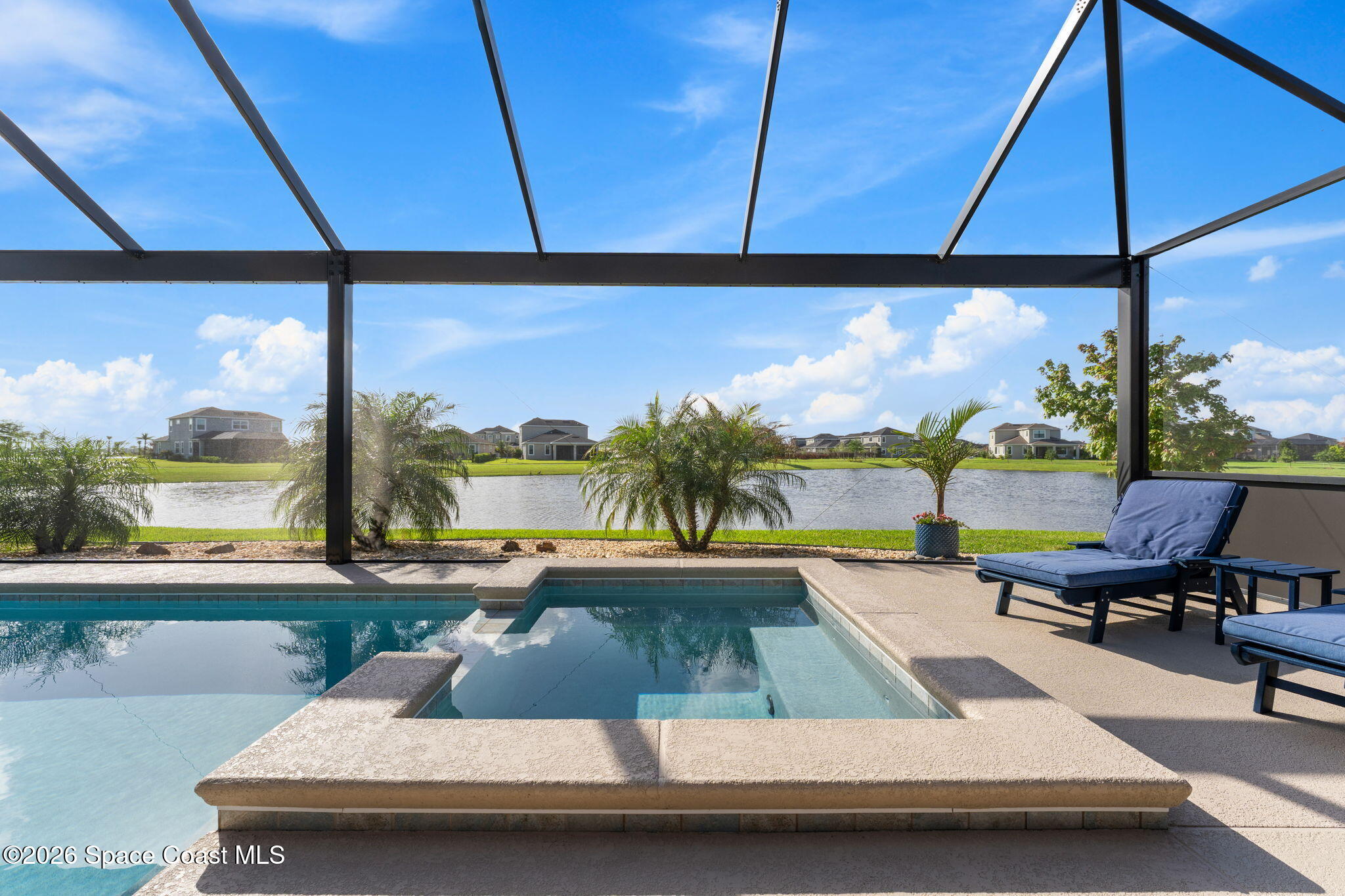 3236 Becorden Way Melbourne, FL 32940 - Photo 32 of 40 a view of a swimming pool and lounge chair