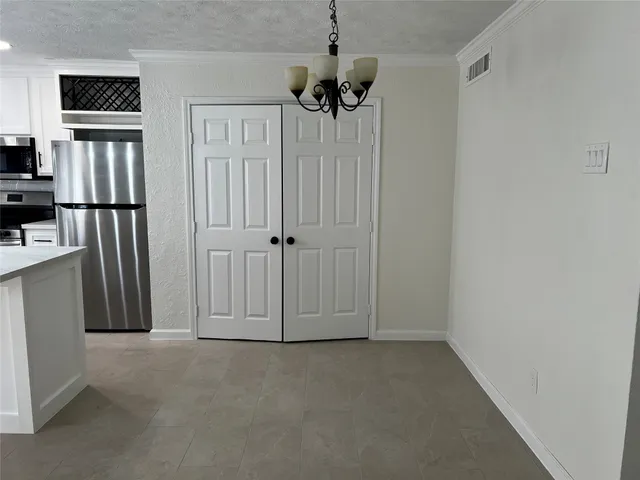 a view of a livingroom with a kitchen