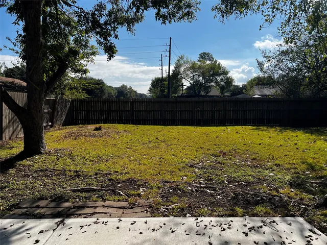 a view of a swimming pool and a yard