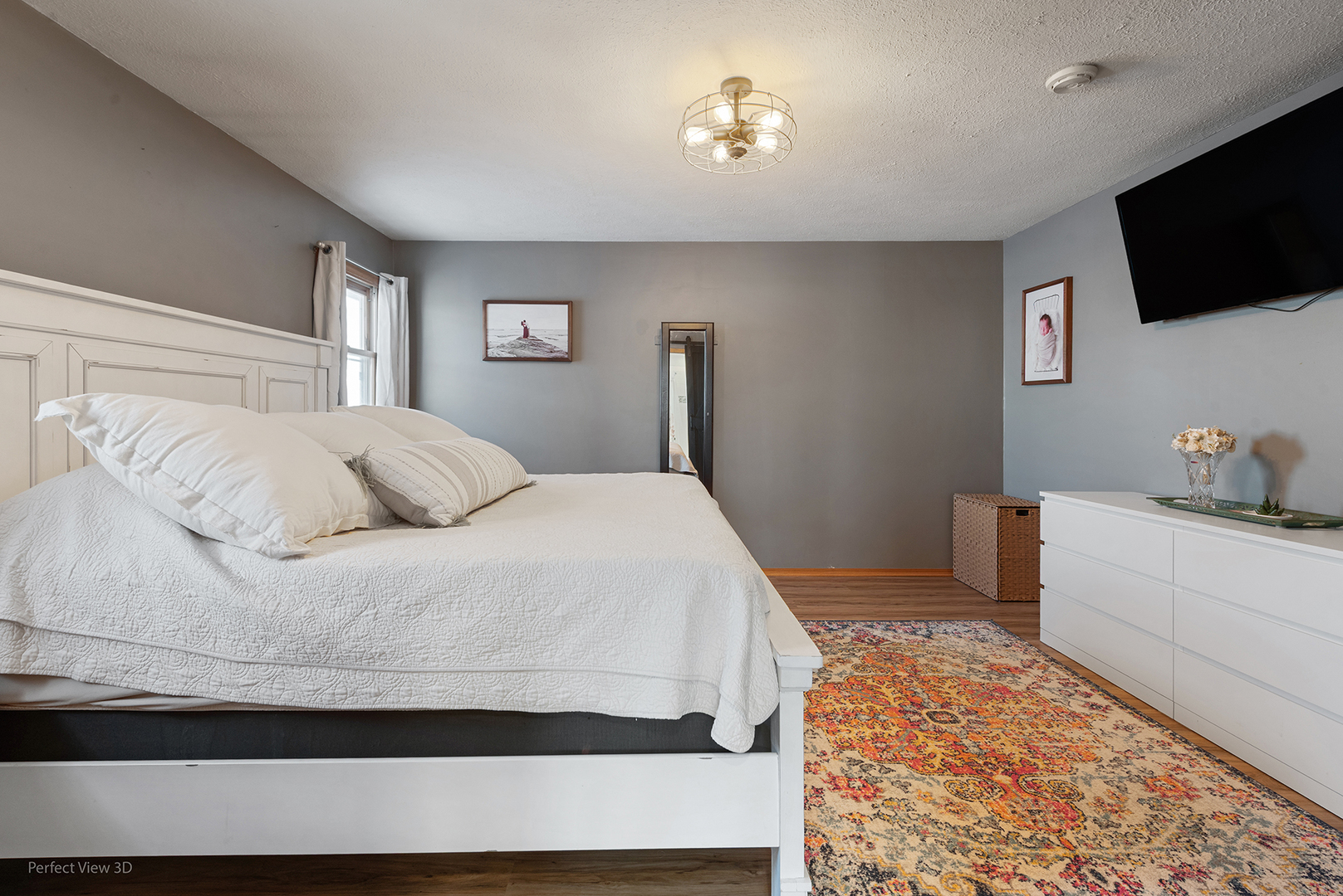 32209 North 1500 E Road Blackstone, IL 61313 - Photo 15 of 23 a bedroom with a bed and a flat screen tv