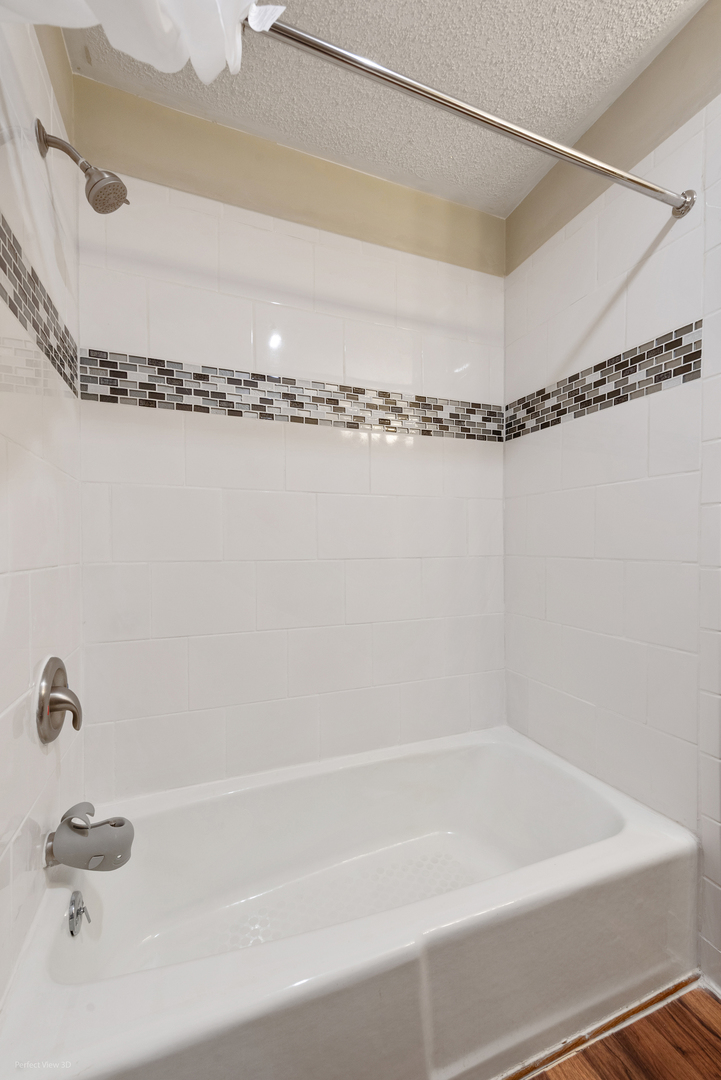 32209 North 1500 E Road Blackstone, IL 61313 - Photo 22 of 23 a bathroom with a shower and tub