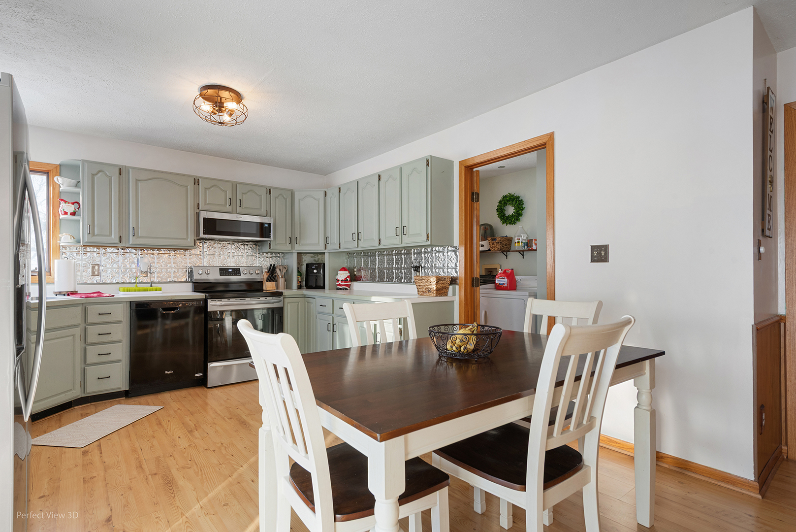 32209 North 1500 E Road Blackstone, IL 61313 - Photo 6 of 23 a kitchen with a dining table chairs and refrigerator