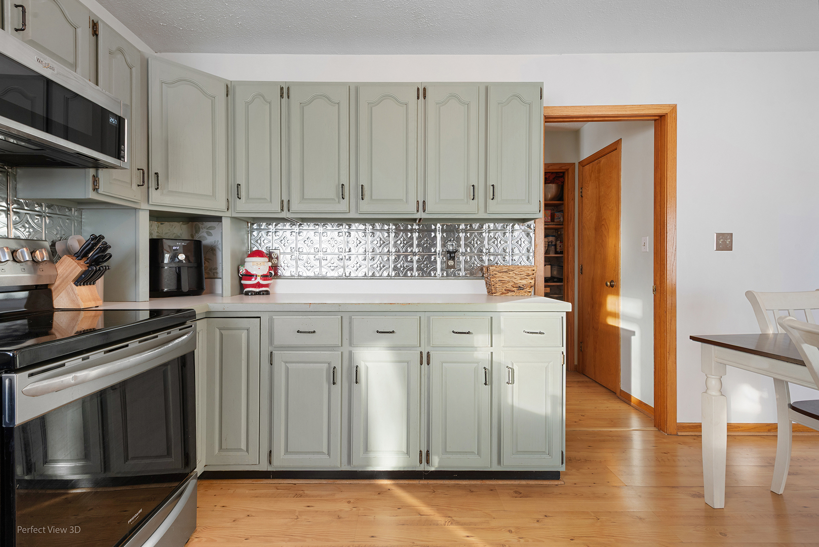 32209 North 1500 E Road Blackstone, IL 61313 - Photo 9 of 23 a kitchen with stainless steel appliances granite countertop a stove a sink and cabinets