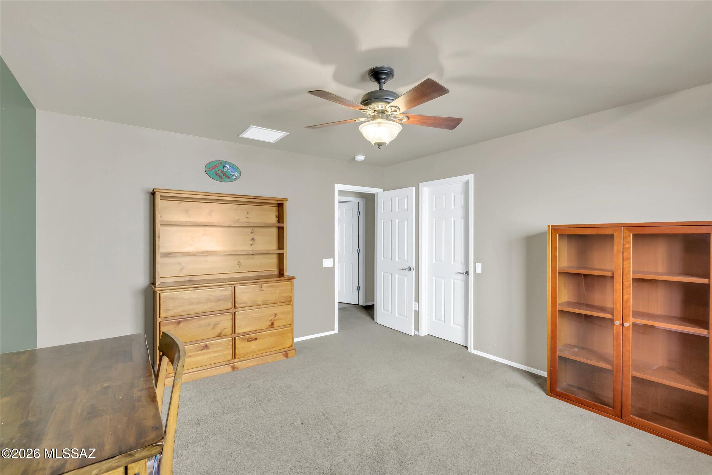 6095 South Jakemp Trail Tucson, AZ 85747 - Photo 34 of 52 a view of an empty room with a window