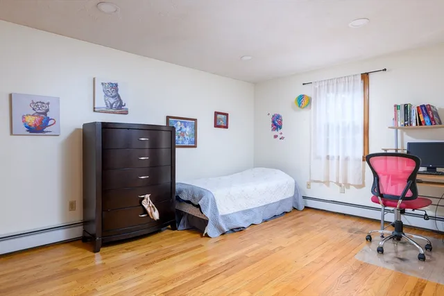 a bedroom with a bed and cabinets