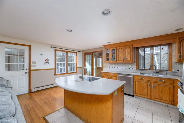 a kitchen with stainless steel appliances granite countertop a sink and cabinets