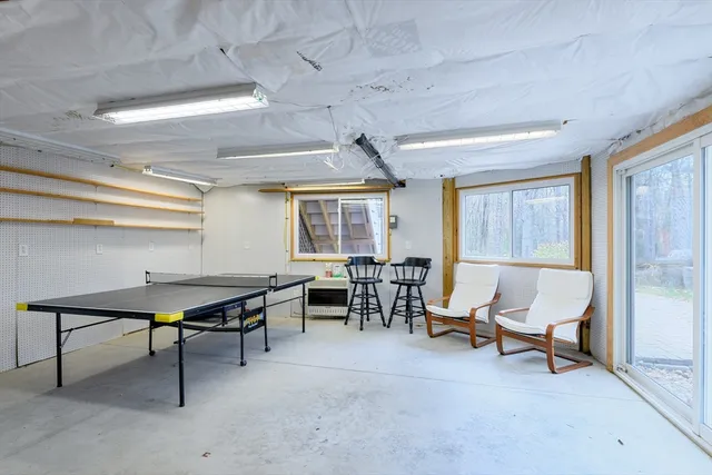 a living room with furniture a window and a table