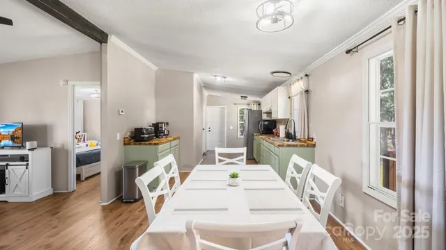 a dining room with furniture and window