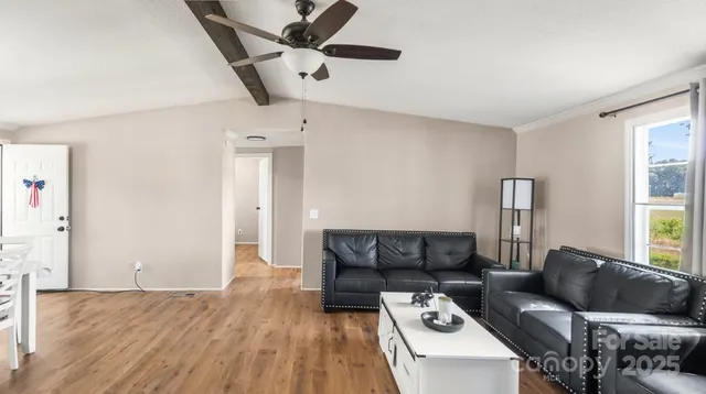 a kitchen with a sink appliances cabinets and a window