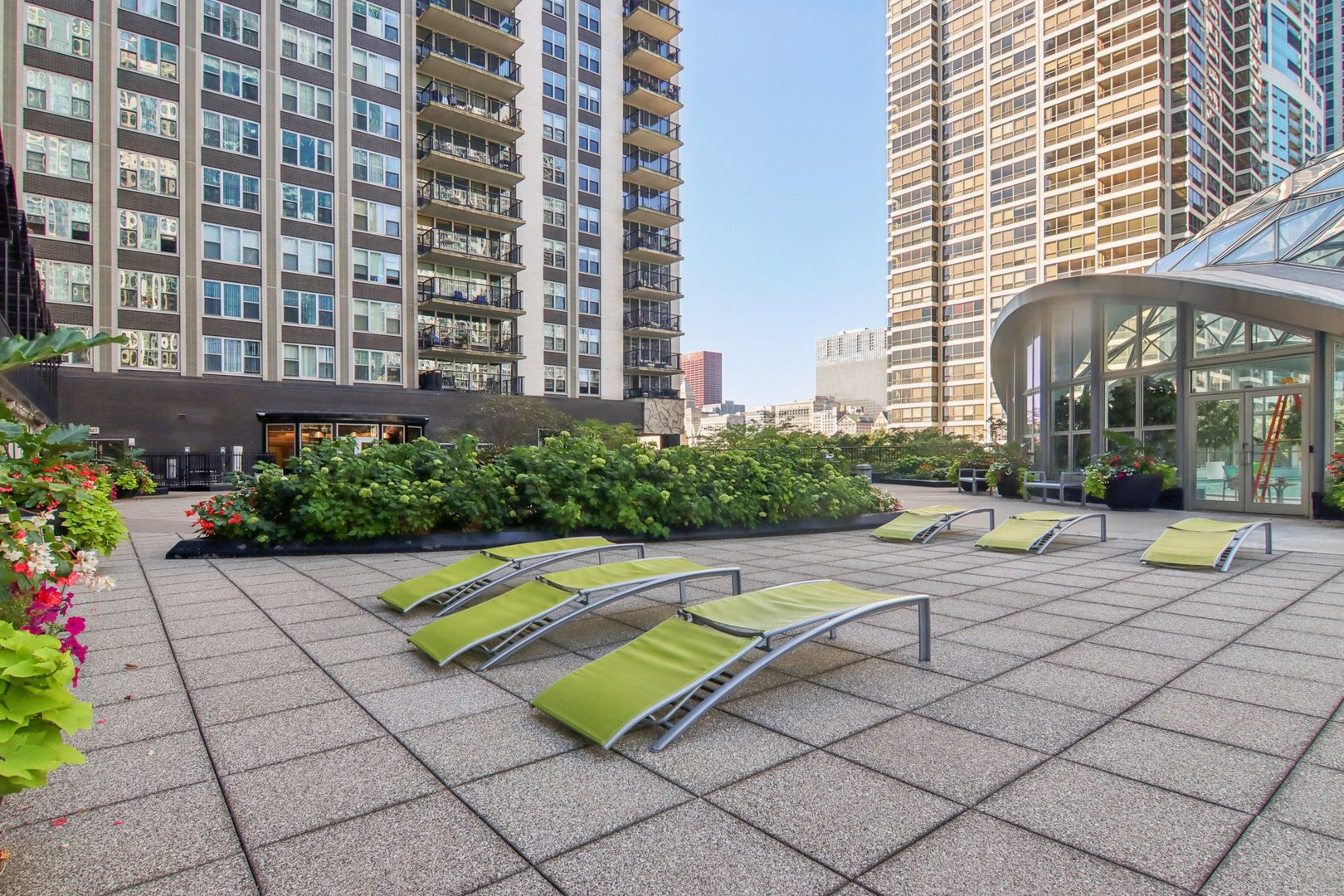 400 East Randolph Street, Unit 3714 Chicago, IL 60601 - Photo 20 of 23 a view of a swimming pool with a lounge chairs
