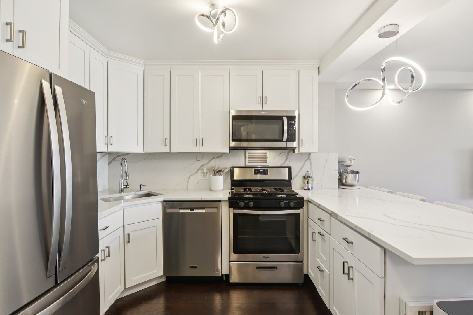 400 East Randolph Street, Unit 3714 Chicago, IL 60601 - Photo 5 of 23 a kitchen with a stove microwave and a refrigerator