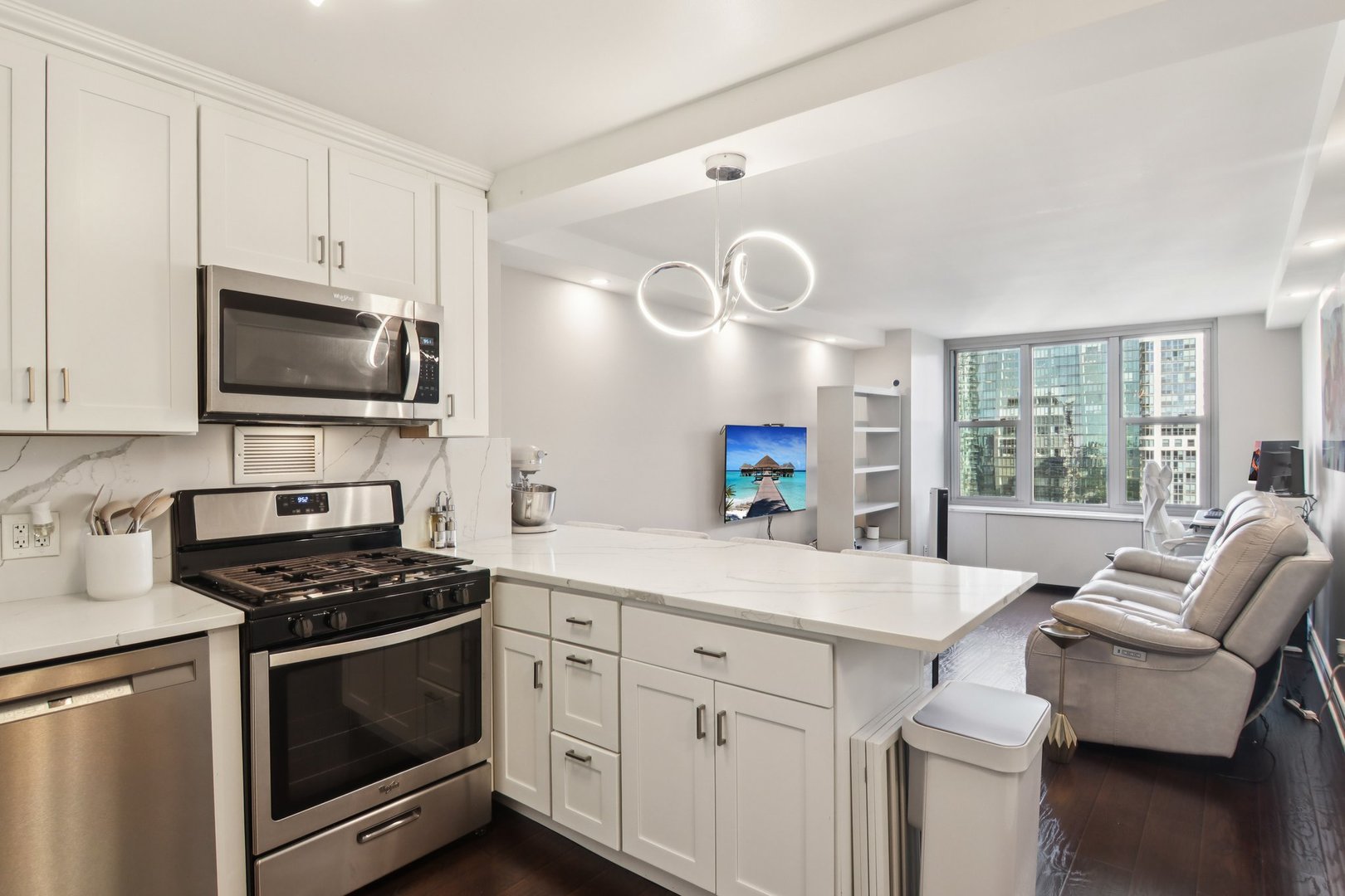 400 East Randolph Street, Unit 3714 Chicago, IL 60601 - Photo 6 of 23 a kitchen with cabinets appliances and a window
