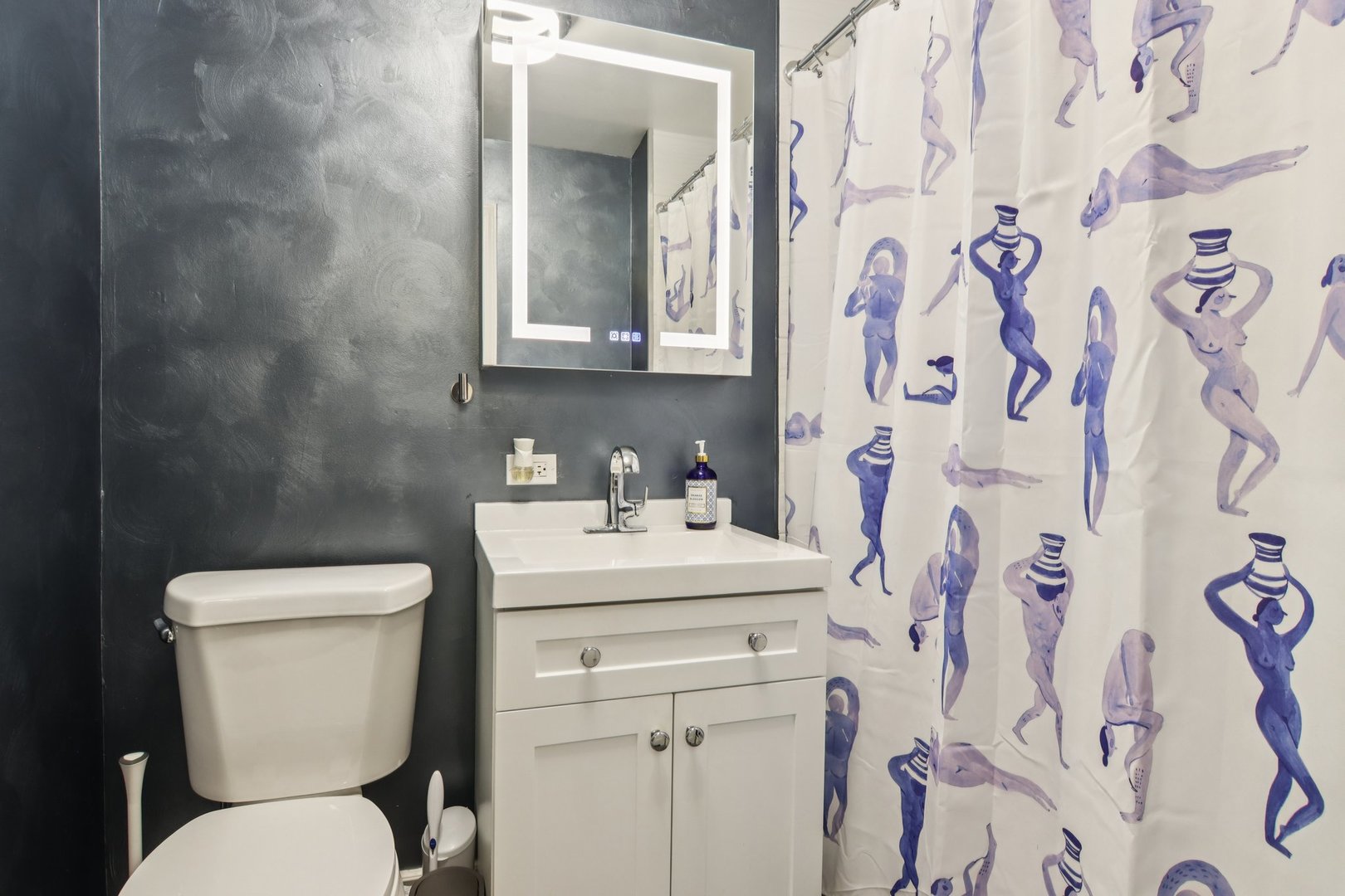 400 East Randolph Street, Unit 3714 Chicago, IL 60601 - Photo 9 of 23 a bathroom with a toilet sink and mirror