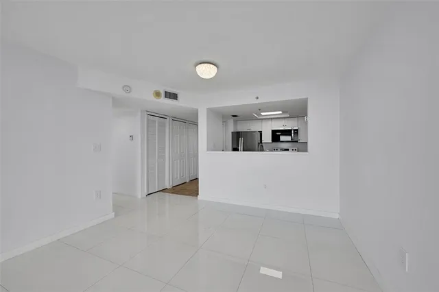 a view of a kitchen with a sink and cabinets