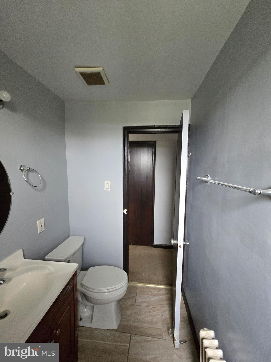 428 Ridge Road Southeast, Unit 305 Washington, DC 20019 - Photo 10 of 23 a bathroom with a granite countertop sink toilet and shower