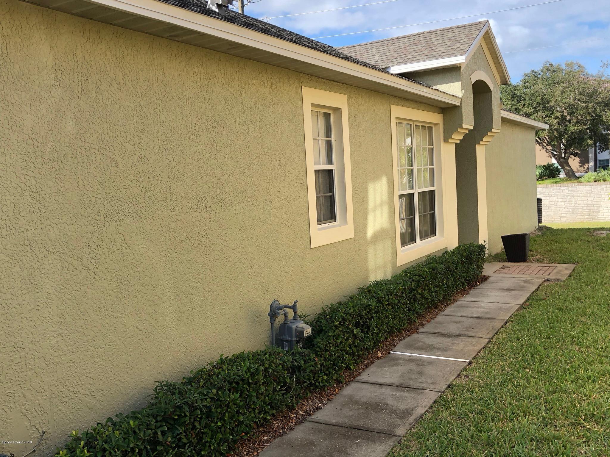 314 Intrepid Way Melbourne, FL 32903 - Photo 2 of 31 a view of a house with a backyard