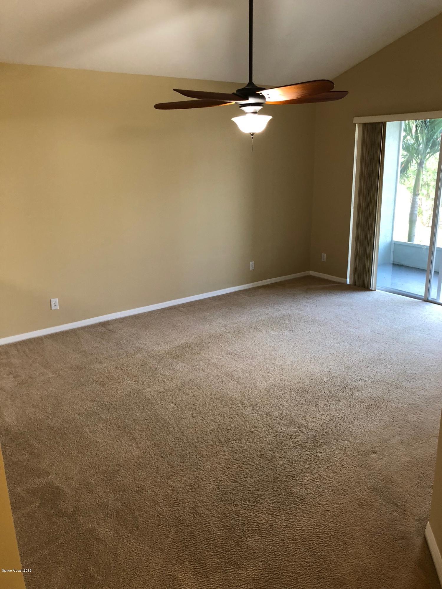 314 Intrepid Way Melbourne, FL 32903 - Photo 13 of 31 a view of an empty room with window chandelier fan and table