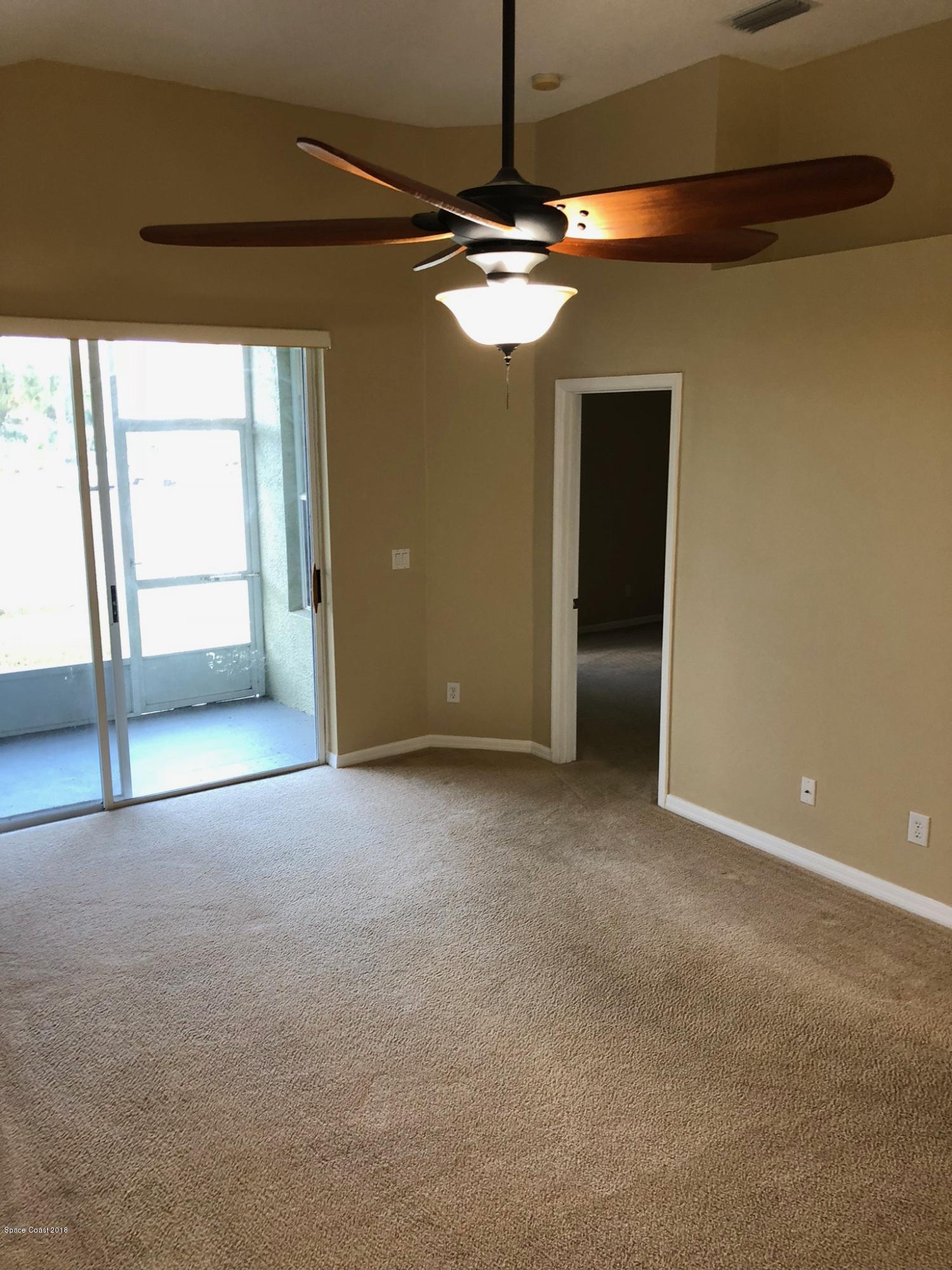 314 Intrepid Way Melbourne, FL 32903 - Photo 16 of 31 a view of an empty room with a window