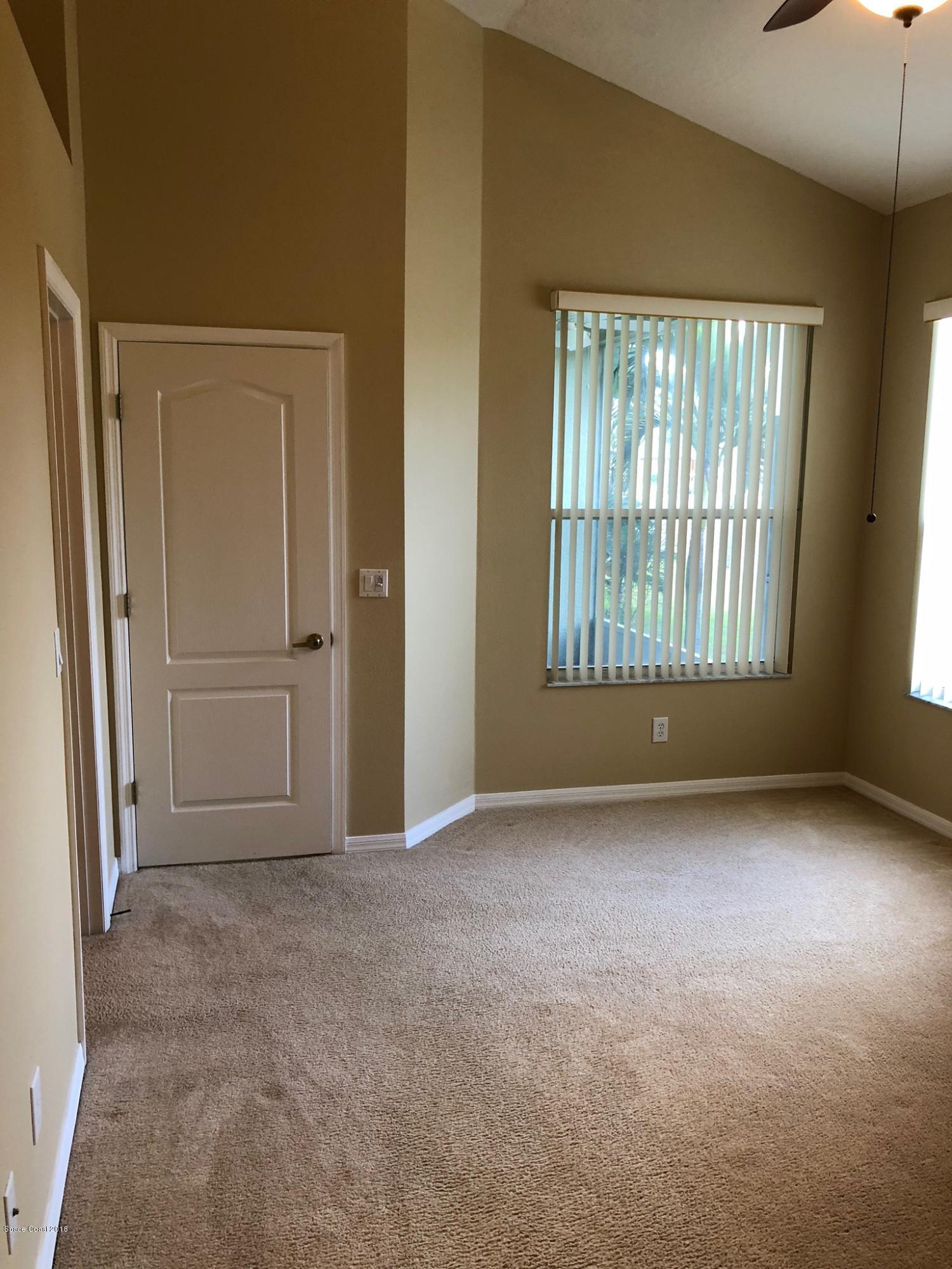 314 Intrepid Way Melbourne, FL 32903 - Photo 18 of 31 an empty room with windows