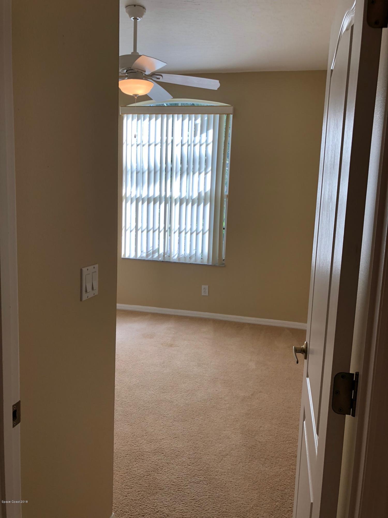 314 Intrepid Way Melbourne, FL 32903 - Photo 28 of 31 a view of an empty room with a window