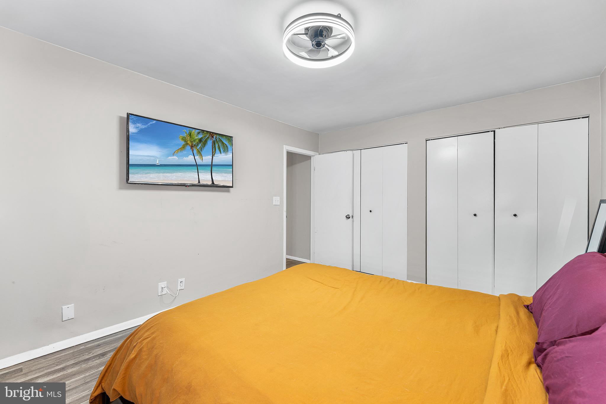 115 East Kings Highway, Unit 186 Maple Shade, NJ 08052 - Photo 15 of 25 a bed room with a bed and a painting on the wall
