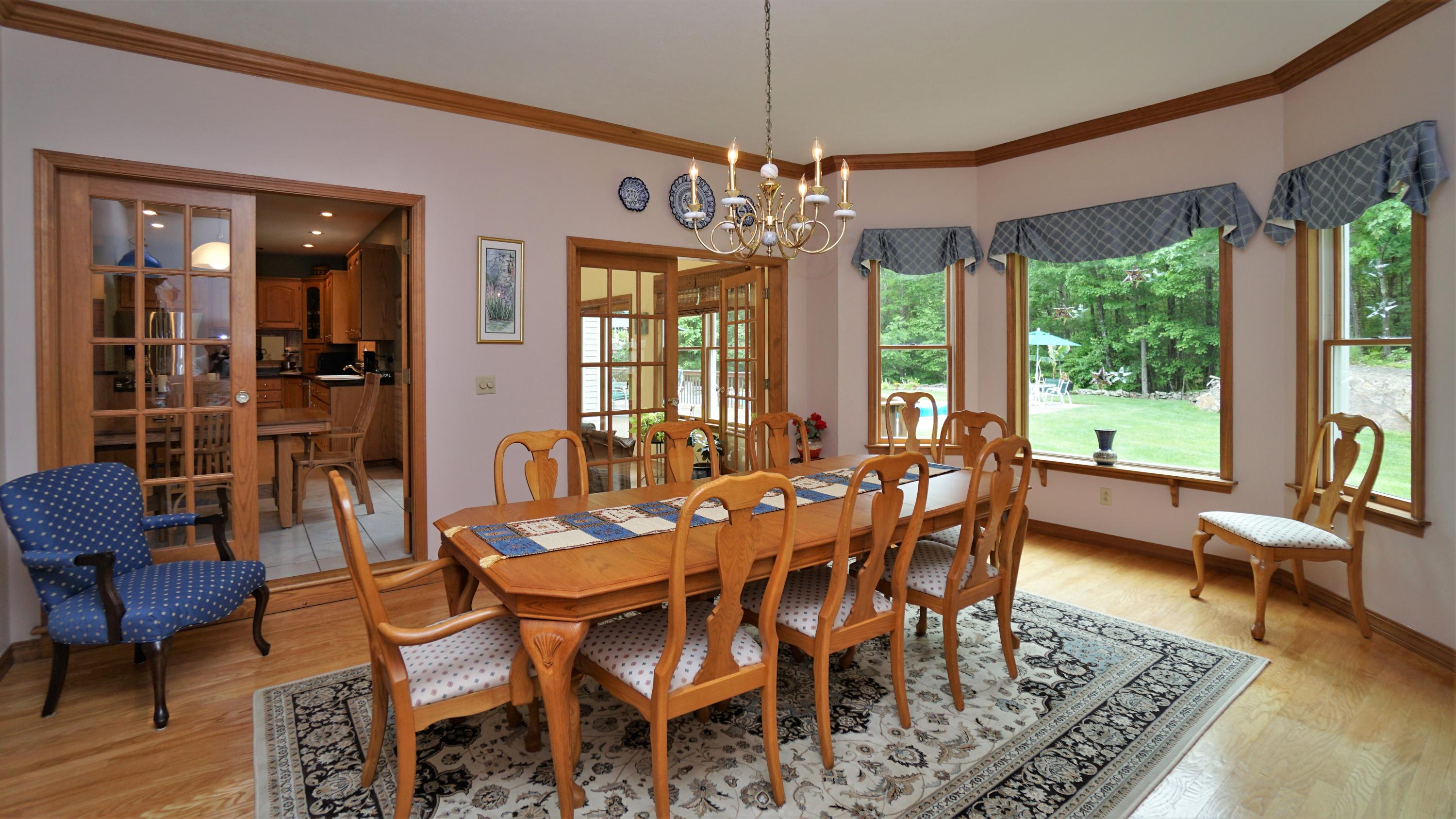 12 Pond Ridge Drive Lewiston, ME 04240 - Photo 13 of 69 Dining Room to Kitchen and Sun Porch