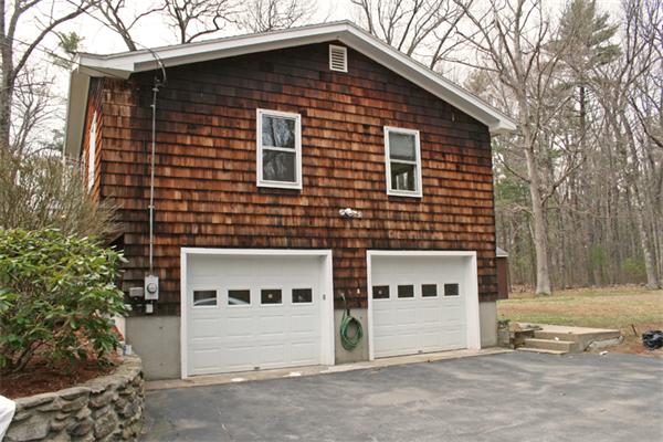 85 Wildwood Road Lunenburg, MA 01462 - Photo 3 of 15 a front view of a house with a yard