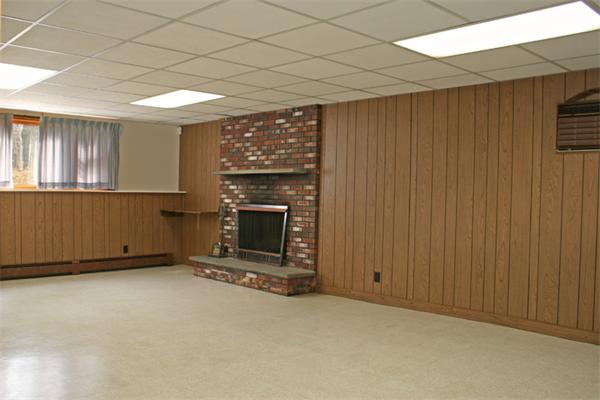 85 Wildwood Road Lunenburg, MA 01462 - Photo 9 of 15 an empty room with a fireplace