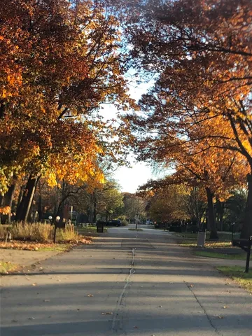 a kitchen with stainless steel appliances granite countertop a sink a stove and a wooden cabinets