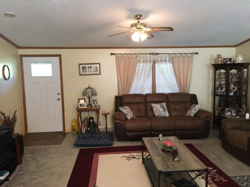 97 North Howard Fitch Road Kelso, TN 37348 - Photo 17 of 30 a living room with furniture and a chandelier