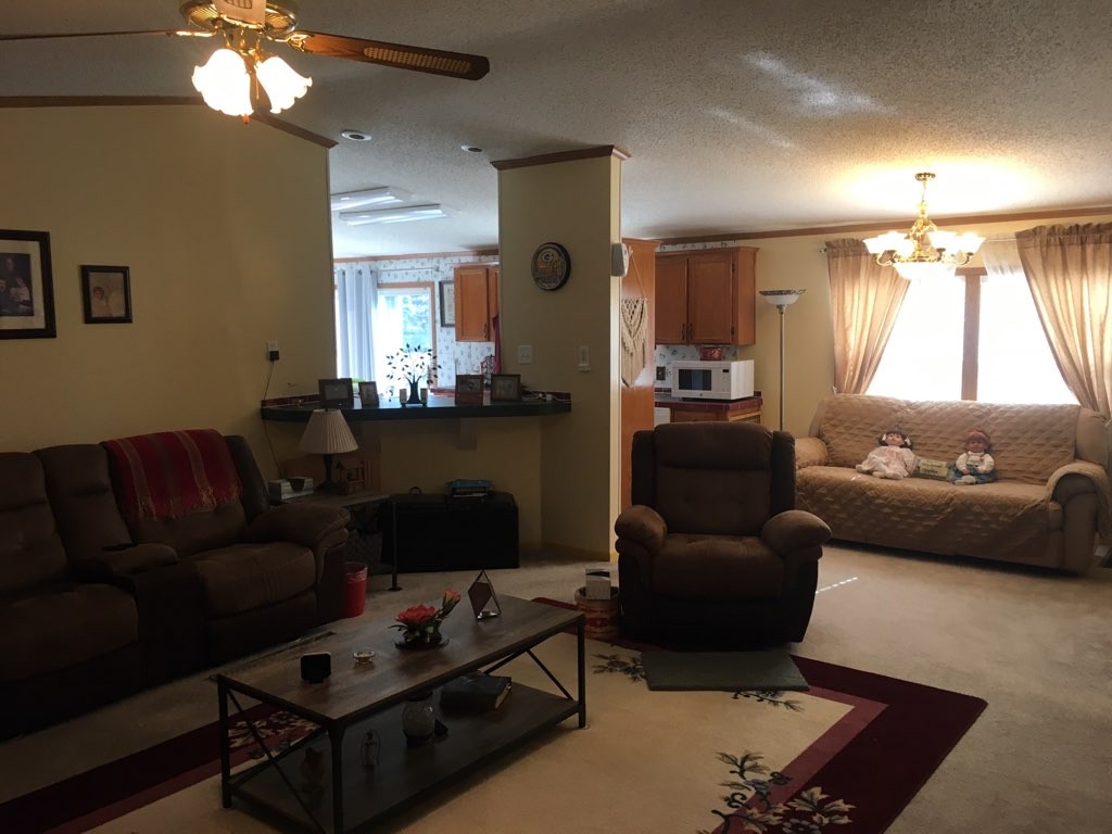 97 North Howard Fitch Road Kelso, TN 37348 - Photo 18 of 30 a living room with furniture and a chandelier