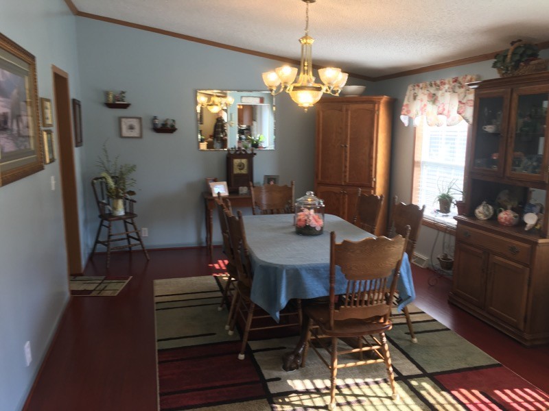 97 North Howard Fitch Road Kelso, TN 37348 - Photo 19 of 30 a view of a dining room with furniture and chandelier