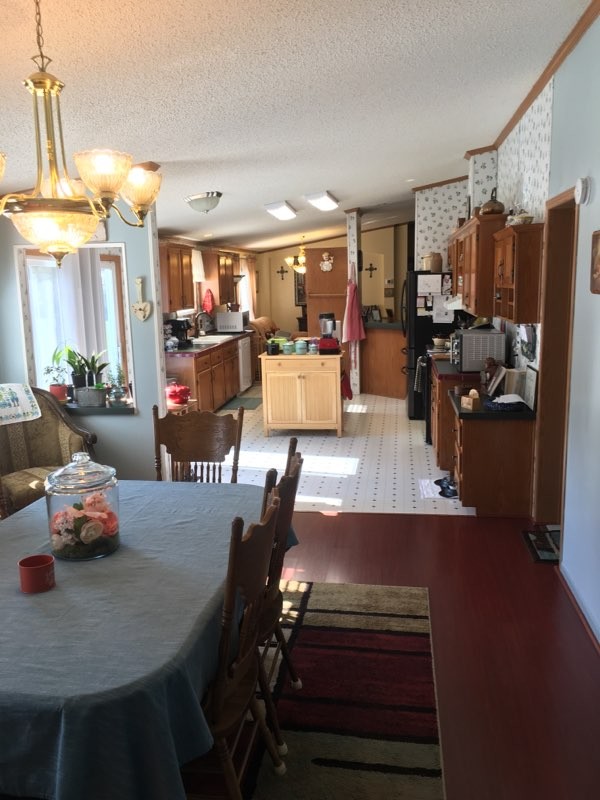 97 North Howard Fitch Road Kelso, TN 37348 - Photo 20 of 30 a living room with furniture and a chandelier