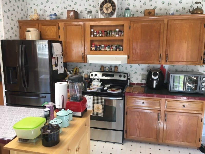 97 North Howard Fitch Road Kelso, TN 37348 - Photo 22 of 30 a kitchen with stainless steel appliances granite countertop a sink and a refrigerator