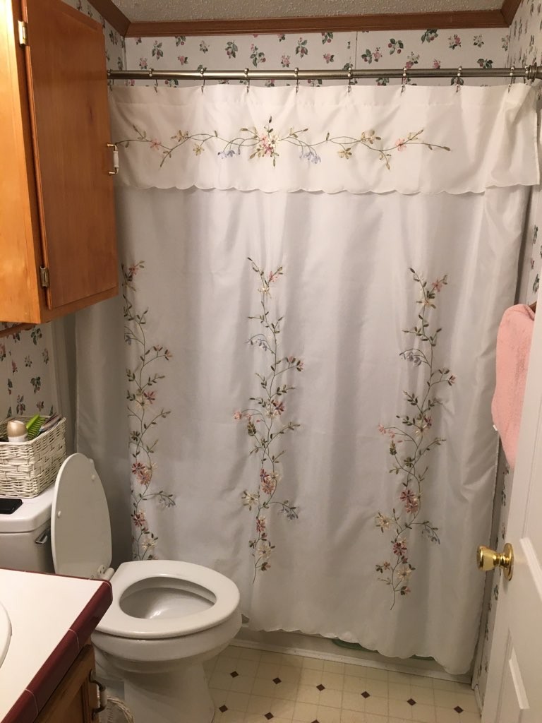 97 North Howard Fitch Road Kelso, TN 37348 - Photo 25 of 30 a bathroom with a toilet and a shower curtain