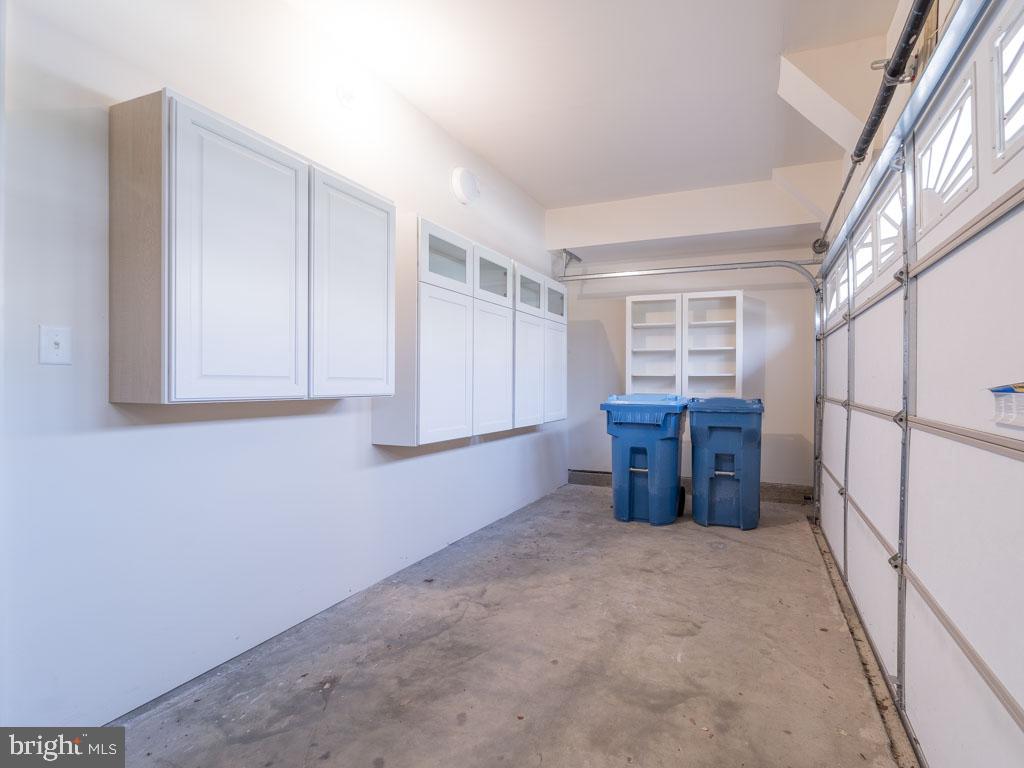 22595 Windsor Locks Square Ashburn, VA 20148 - Photo 27 of 56 a view of an empty room with cabinet and a window