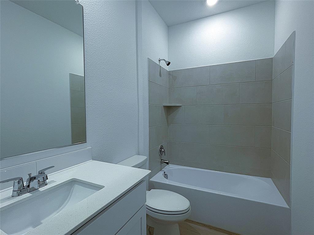 3020 Dutch Road Providence Village, TX 76227 - Photo 13 of 23 a bathroom with a sink a toilet and shower