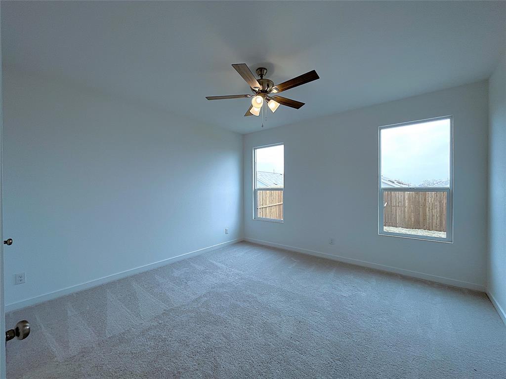 3020 Dutch Road Providence Village, TX 76227 - Photo 15 of 23 an empty room with a window and a fan