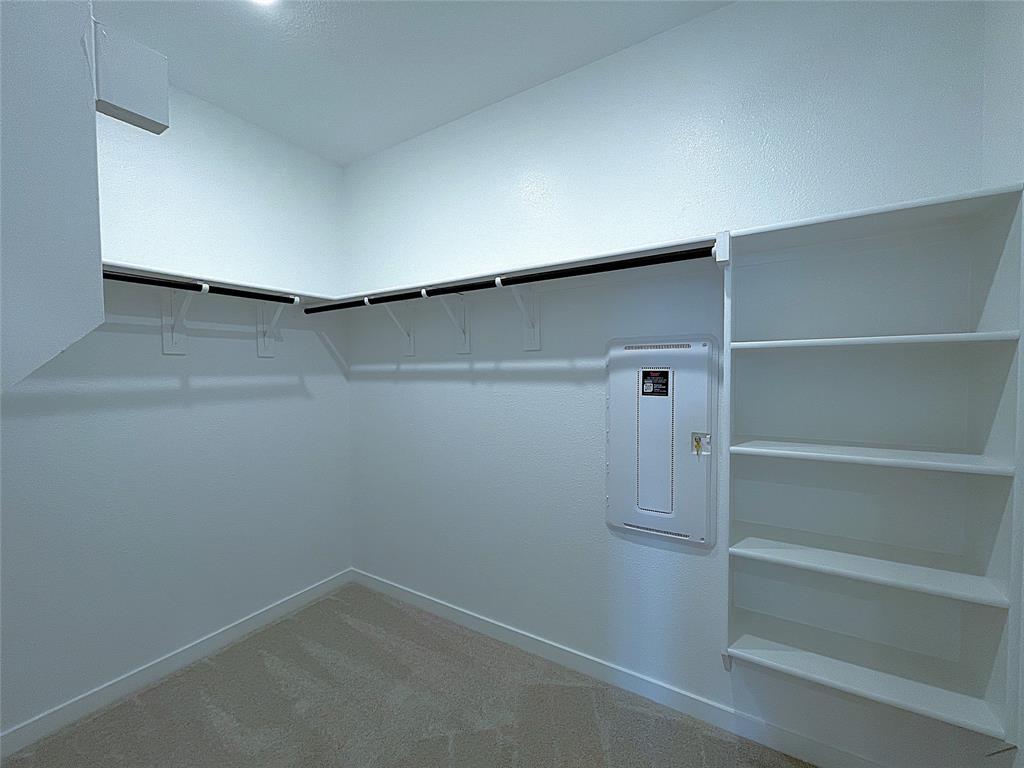 3020 Dutch Road Providence Village, TX 76227 - Photo 18 of 23 a view of an empty walk in closet