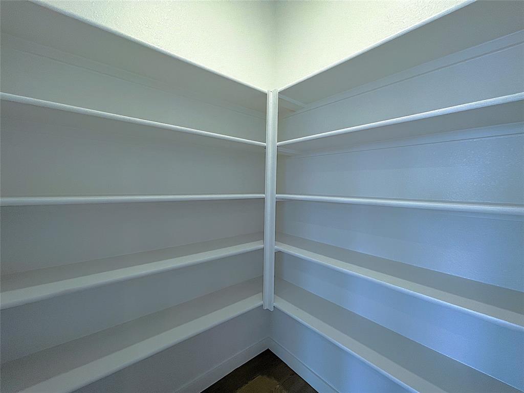3020 Dutch Road Providence Village, TX 76227 - Photo 7 of 23 a view of walk in closet with empty racks