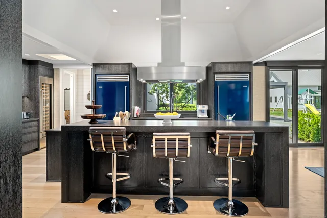 a kitchen with stainless steel appliances granite countertop a sink and cabinets
